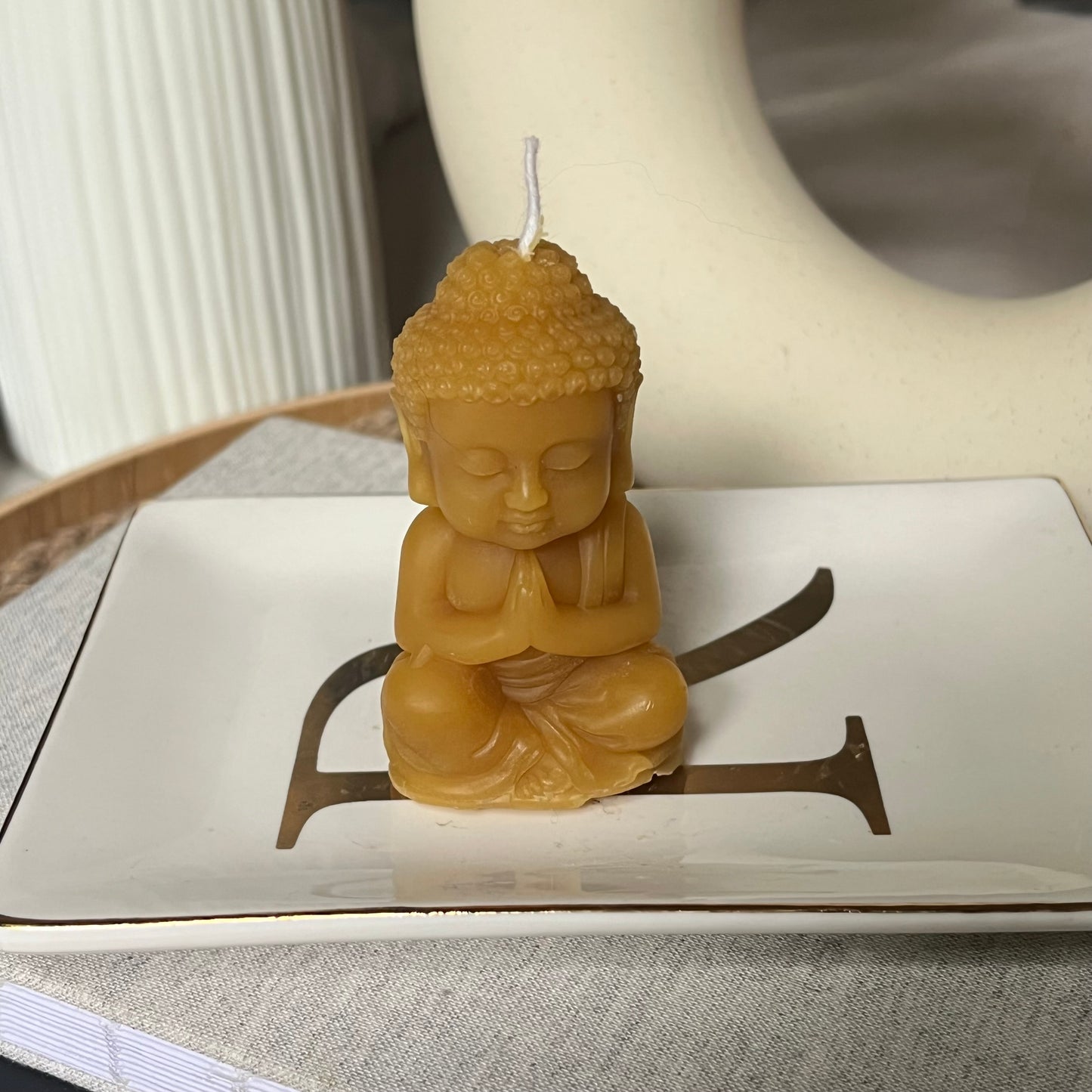 Praying Buddha candle